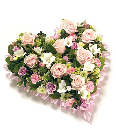 Loose Floral Heart - A beautiful heart shaped tribute, featuring Roses, Eustoma, Chrysanthemums, fragranced Freesias and complementary foliage with a ribbon edge.

Delivering in Norwich and surrounding areas (please check on our delivery page for areas we cover)

Our funeral designs are created with care and hand delivered to the funeral directors.
